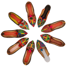 Load image into Gallery viewer, Old Fashioned Online Nine very colourful hand crafted embroidered leather house shoes that are arranged in a circle