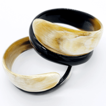Load image into Gallery viewer, A picture of pair of Small Old Fashioned Online Minimalist polished Ivory to ebony Artisan spiral Cuff bangle, made from ethically sourced natural horn