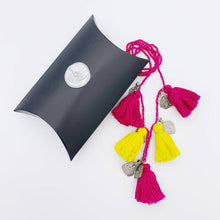 Load image into Gallery viewer, Ethically sourced Old Fashioned Online multi coloured pink beaded necklace with rink and yellow tassels and five silver amulet charms with gift box