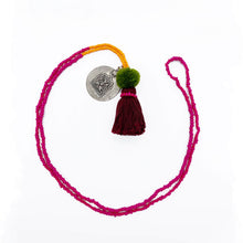 Load image into Gallery viewer, Colorful Old Fashioned Online beads with tassel, pompom and silver amulet charm necklace in pink and blue on flat lay