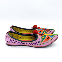 Load image into Gallery viewer, Ethically sourced bohemian Old Fashioned Online Pink Leather slip-on with blue, green and red triangle embroidery, red pompoms and cushioned footbed side view2