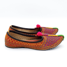 Load image into Gallery viewer, Pink and blue comfy Old Fashioned Online house flats ethical bohemian Leather slippers with lattice style embroidery, pompoms and red cushioned footbed side view 2