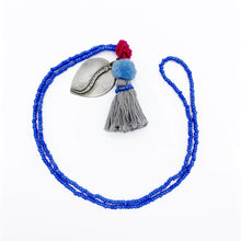 Load image into Gallery viewer, Colorful Old Fashioned Online beads with tassel, pompom and silver amulet charm necklace in pink and blue flat lay