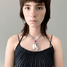 Load image into Gallery viewer, Colorful Old Fashioned Online beads with tassel, pompom and silver amulet charm in pink and blue on girl wearing blue denim