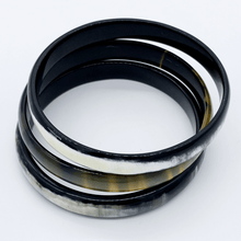 Load image into Gallery viewer, A picture of a stack of 6 slender monochrome Old Fashioned Online bangle bracelet, ethically sourced natural buffalo horn