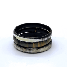 Load image into Gallery viewer, A picture of a spinning stack of 6 slender monochrome Old Fashioned Online bangle bracelet, ethically sourced natural buffalo horn