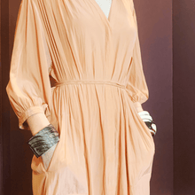 Load image into Gallery viewer, girl in peach dress wearing natural buffalo horn bracelet with her hands in her pockets