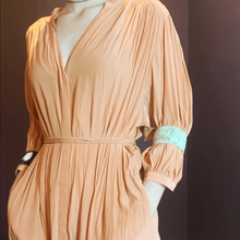 Load image into Gallery viewer, A picture of a girl wearing old fashioned online buffalo horn cuffs over the top of her 3 quarter sleeves