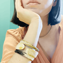 Load image into Gallery viewer, girl in peach dress wearing 2 ebony horn bracelets and simple gold chain