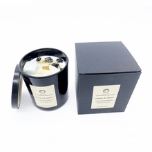 Load image into Gallery viewer, A picture of a large white candle sprinkled with flower next to the box it comes in. petals and a crystal imbedded in it