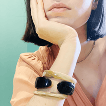 Load image into Gallery viewer, girl in peach dress wearing 2 ebony horn bracelet and simple gold chain
